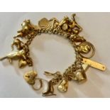 A 9ct gold charm bracelet and charms. 29.2gms.Condition ReportGood condition.