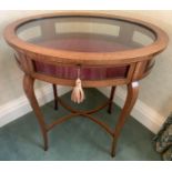 An Edwardian mahogany inlaid oval vitrine. 69 w x 48 d x 76cms h.Condition ReportGood condition,