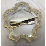 A Venetian style decorative glass framed wall mirror. 35cms h x 30cms w.Condition ReportLooks to