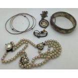 Jewellery to include a hallmarked silver bangle, a hallmarked silver medal on a white metal chain, a