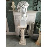 A plaster bust of Julius Caesar on a pedestal base stand with Roman scene. Bust 60cms h, pedestal