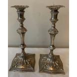 A good pair of cast Georgian silver candlesticks 1776 by John Carter 28.5cms h. Not weighted.