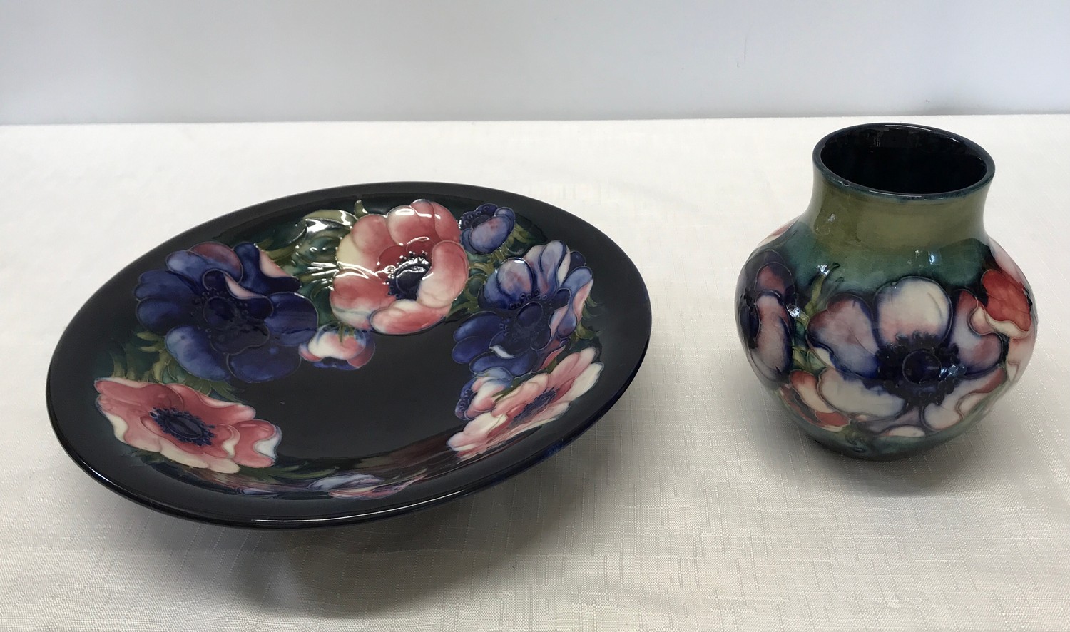 Two Moorcroft pottery Anemone design vase and bowl. Vase 13cm with signature mark to base along with