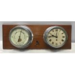 A chrome cased ships clock and aneroid barometer mounted on pine by Cooke of Hull. Back plate