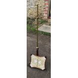 Victorian rosewood and brass fireside pole screen with needlework framed panel and claw feet.