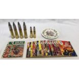 A mixed lot to include 17 x War Picture comics, 2 x Air Sea Rescue comics, 4 x 30mm Cannon shells, 2