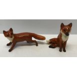 Two Beswick foxes from the Hunt Series. Running fox 5.5cms h x 10cms l and seated fox 7.5cms h.