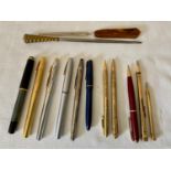 A selection of writing equipment to include 6 fountain pens- one green and black Pelikan M400 with