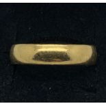 An 18ct gold wedding band with the millennium mark. 8.3gms weight. Size U.