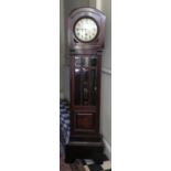 A mahogany longcase clock with a bevelled glass panel door. 180cm h x 45cm w x 27cm d. Dial is