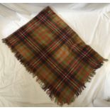 A wool blanket with a brown check pattern. Approx. 130cm x 150cm.Condition ReportTwo small