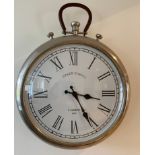 A wall mounted battery operated wall clock. 38cms d.Condition ReportSome scuffs to back.