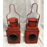 A pair of railway lamps, red, one with BR stamp British Railway, height including handle 53cms h.