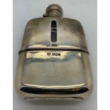 A hallmarked silver spirit flask. Sheffield 1924 maker G & J W Hawksley. 13cms h. Silver weight