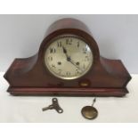 A mahogany cased mantle clock with DRM brass movement 25cms h x 14cms d x 42cms w. with a steel face