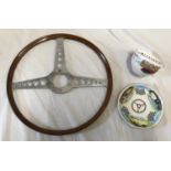 A vintage wood steering wheel 40.5cm d and a Royal Worchester cup and saucer with vintage cars