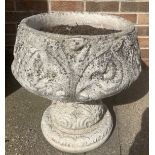 A single reconstituted stone urn. 46cms h x 43cms d.