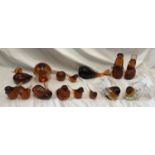 A collection of 15 amber coloured glass paperweights of birds and animals to include 7 stamped