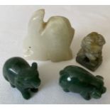 Four various green stone animals to include pig , elephant, rabbit and dog of fo. Rabbit 5.5cms h.