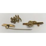 A 15ct gold pin brooch set with pearls a/f in three pieces. Approx. gross weight 3gms.Condition