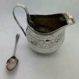 A hallmarked silver cream jug London 1810 initialled to front together with a hallmarked silver