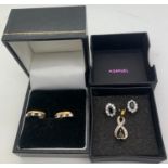 A pair of sapphire and diamond earrings in 9ct gold and a sapphire and diamond pendant.Condition