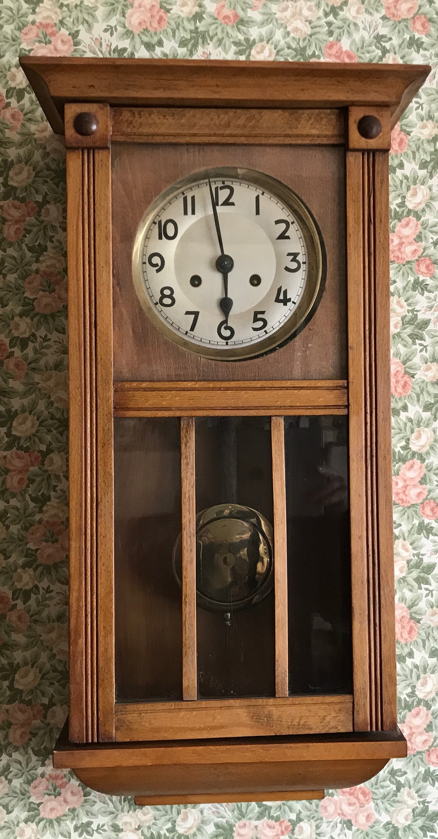 Oak wall clock with visible brass pendulum. 68 x 32 x 17cms d.