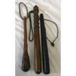 An Irish Bog oak carved truncheon with cloverleaf decoration 34cms l together, an oak truncheon with