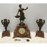 A garniture clock set comprising of a marble cased clock with bronzed spelter figure and "1st