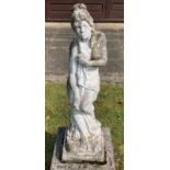 A reconstituted stone garden ornament of a semi clad female figure.Condition ReportGood condition.