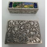 Two Italian white metal lipstick and powder compacts marked .800, both with foliate scroll