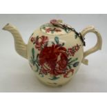 An 18thC Creamware teapot a/f to spout. 18cms l x 11cms h.Condition ReportDamaged spout and