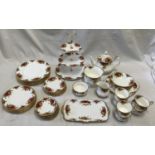 A Royal Albert Old Country Roses Tea and Dinner service set to include a teapot 20cms h, cake stand,