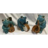 Large glazed pottery garden ornaments of a frog band x 3 to include saxophone, bass and drum.