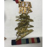 A selection of RFA badges and cap badges.