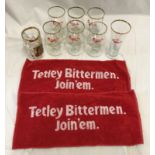 A selection of Carlsberg drinking glasses together with two Tetley Bittermen bar towels.Condition