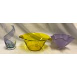 Three pieces of coloured glassware to include a yellow glass bowl 29cms w x 23,5cms x 12cms, a