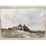 A gilt framed watercolour indistinctly signed lower left of a country scene with houses to the