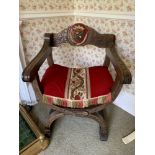 A vintage carved continental cross frame armchair with painted crest to back.Condition ReportGood