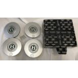 Set of 4 Bentley Kit Hub Caps, 20cms w with packaging box.Condition ReportUsed, minor dent to one