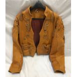 Ladies light brown leather waist length jacket, size M, brass studs and leather tassels.Condition
