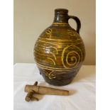 A Michael Cardew Winchcombe Studio Pottery slipware cider flagon with Winchcombe seal marks to base.