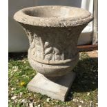 Concrete garden urn with leaf pattern to sides 52cms h x 44cms w.Condition ReportChip break to rim.