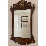 A mahogany and gilt fretted wall mirror with bird to top. 78 h x 46cms w.Condition ReportMarks to