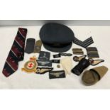 A WWII RAF officers peak cap with badge, uniform patches, squadron patch, tie and a monacle scope.