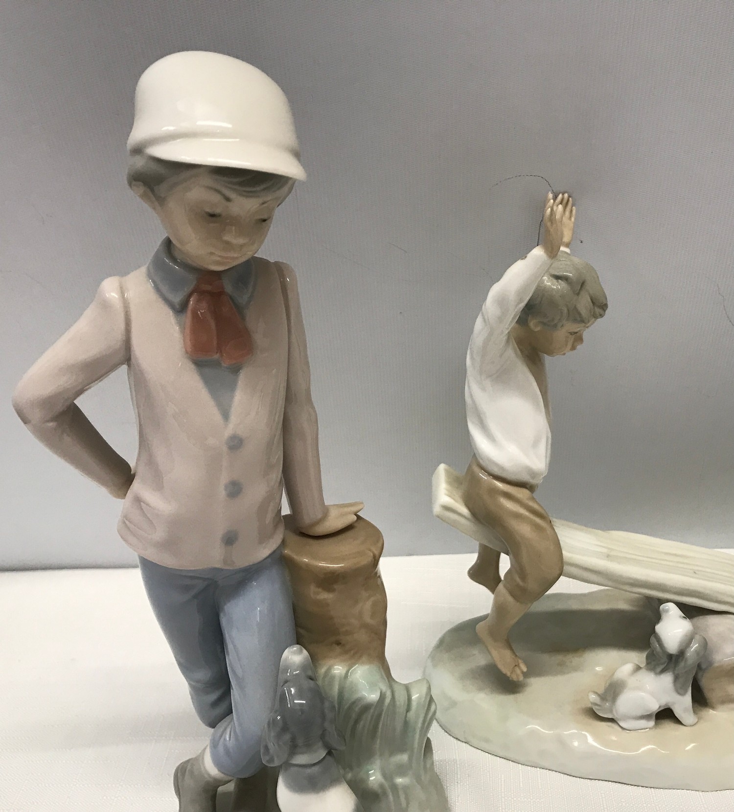 Three Nao Lladro figurines : Girl with Clown Doll 22.5cms h, Boy with Dog 23cms h and Boy and Girl - Image 3 of 6