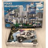A box of Build-It mini bricks Police Headquarters and a Halo UNSC Rocket Warthog by Mega Blocks.