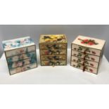 A collection of 3 floral cardboard 4 draw jewellery boxes with decorative design to all 3 and pull