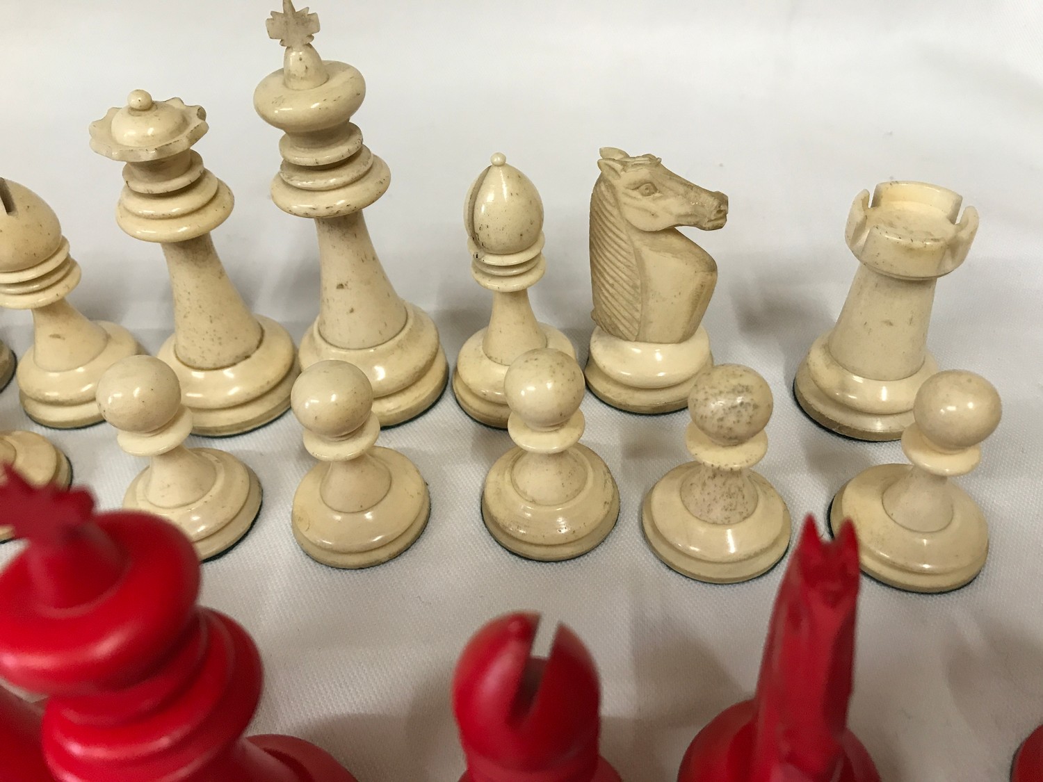 A carved bone red and white chess set. Complete.Condition ReportOne red pawn with glued tip. Overall - Image 3 of 6