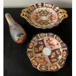 Royal Crown Derby bird paperweight with gold stopper and two Royal Crown Derby dishes, largest 18